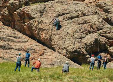 People rock climbing